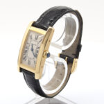 Cartier Tank Americaine in yellow gold on leather strap. REF: W2601556